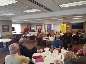 Clayton herron, Gabby boettcher, and Joseph Edwards presenting at the Greenville Rotary.