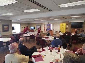 Clayton herron, Gabby boettcher, and Joseph Edwards presenting at the Greenville Rotary.